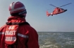 U.S. Coast Guard sailor and helicopter